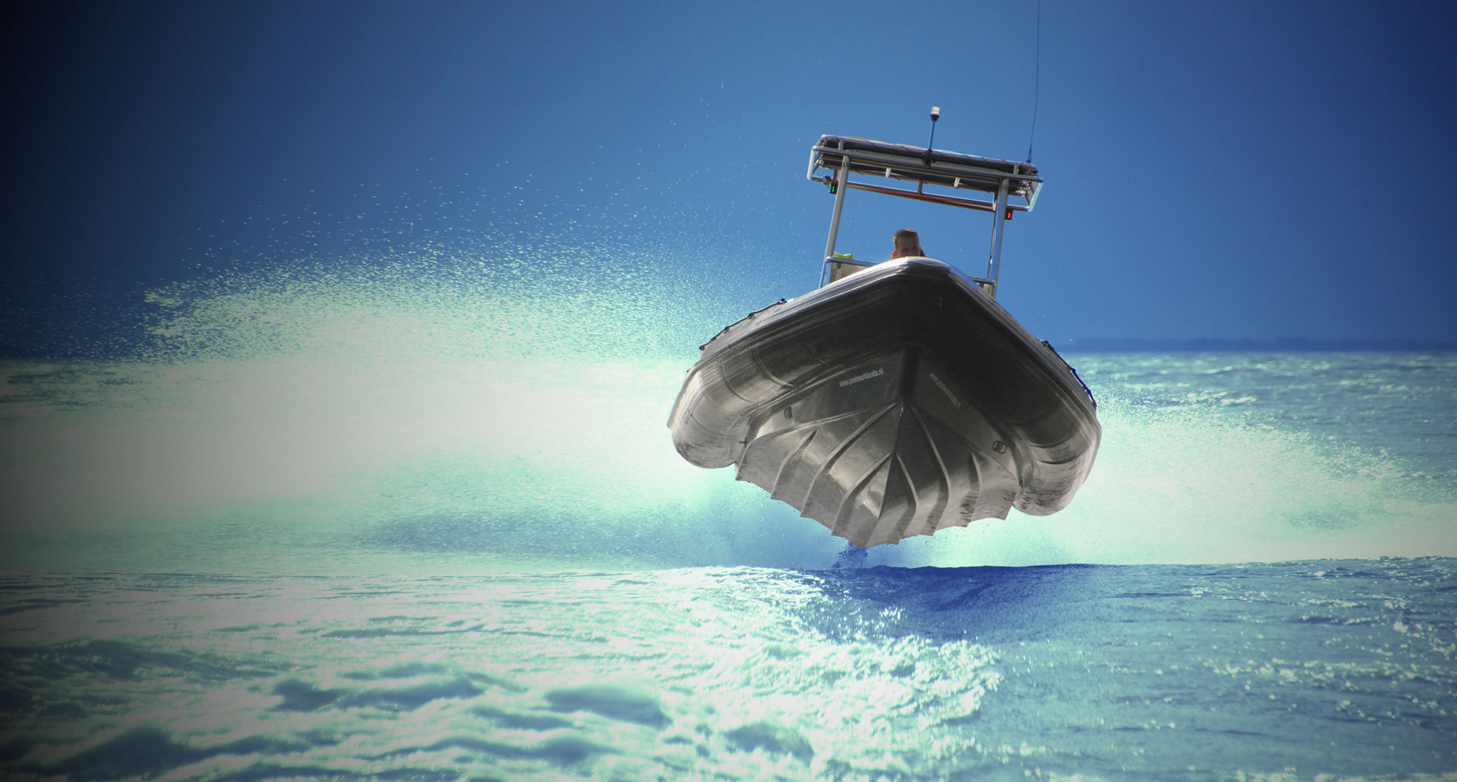 Tornado RIB running at sea
